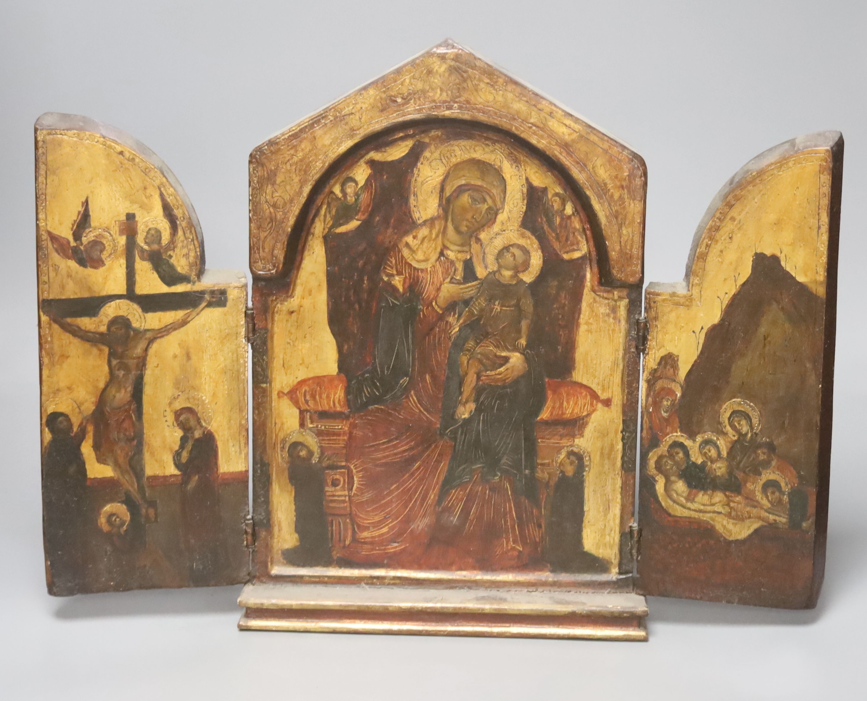 A painted hinged triptich icon, 36 x 37cm (open) 24cm wide closed